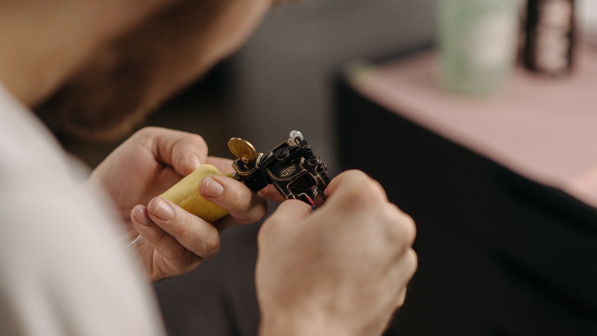Professional tattoo artist working in a studio
