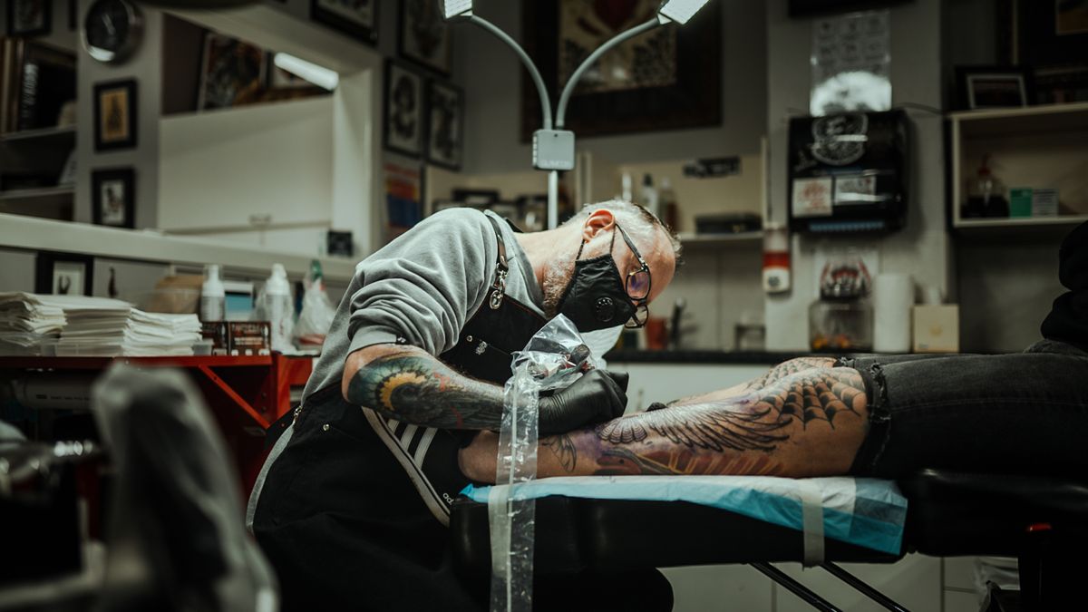 Fine detail tattoo work in progress on skin