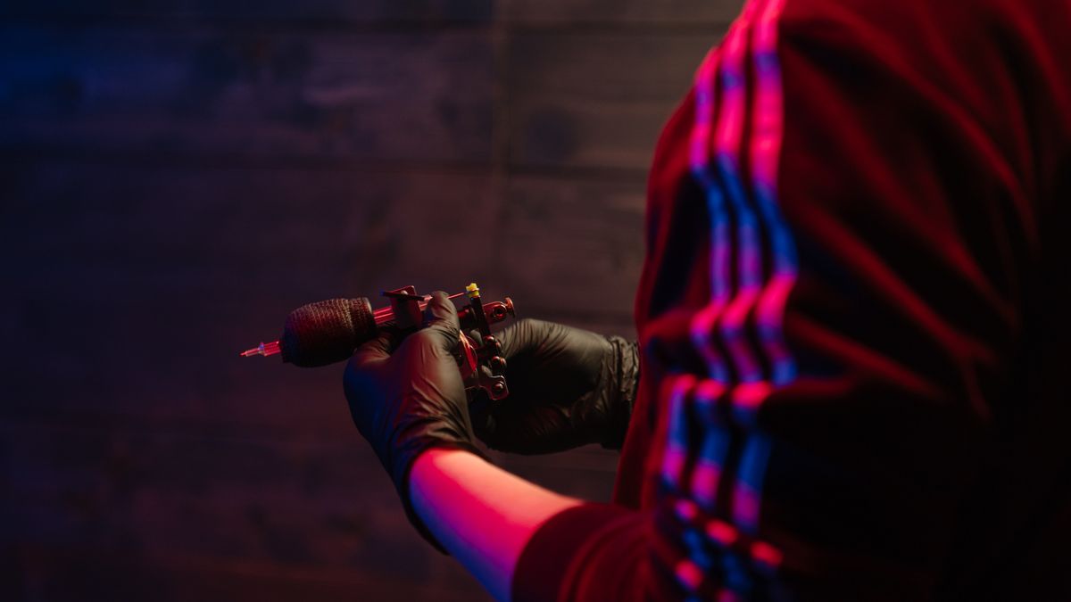 Tattoo artist preparing equipment and workspace before a session